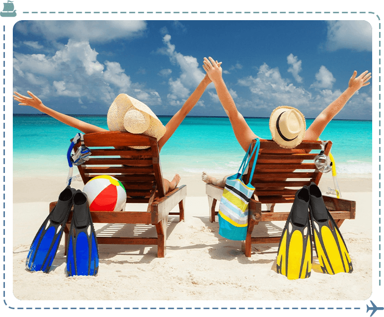 Two people sitting on beach chairs with arms raised.