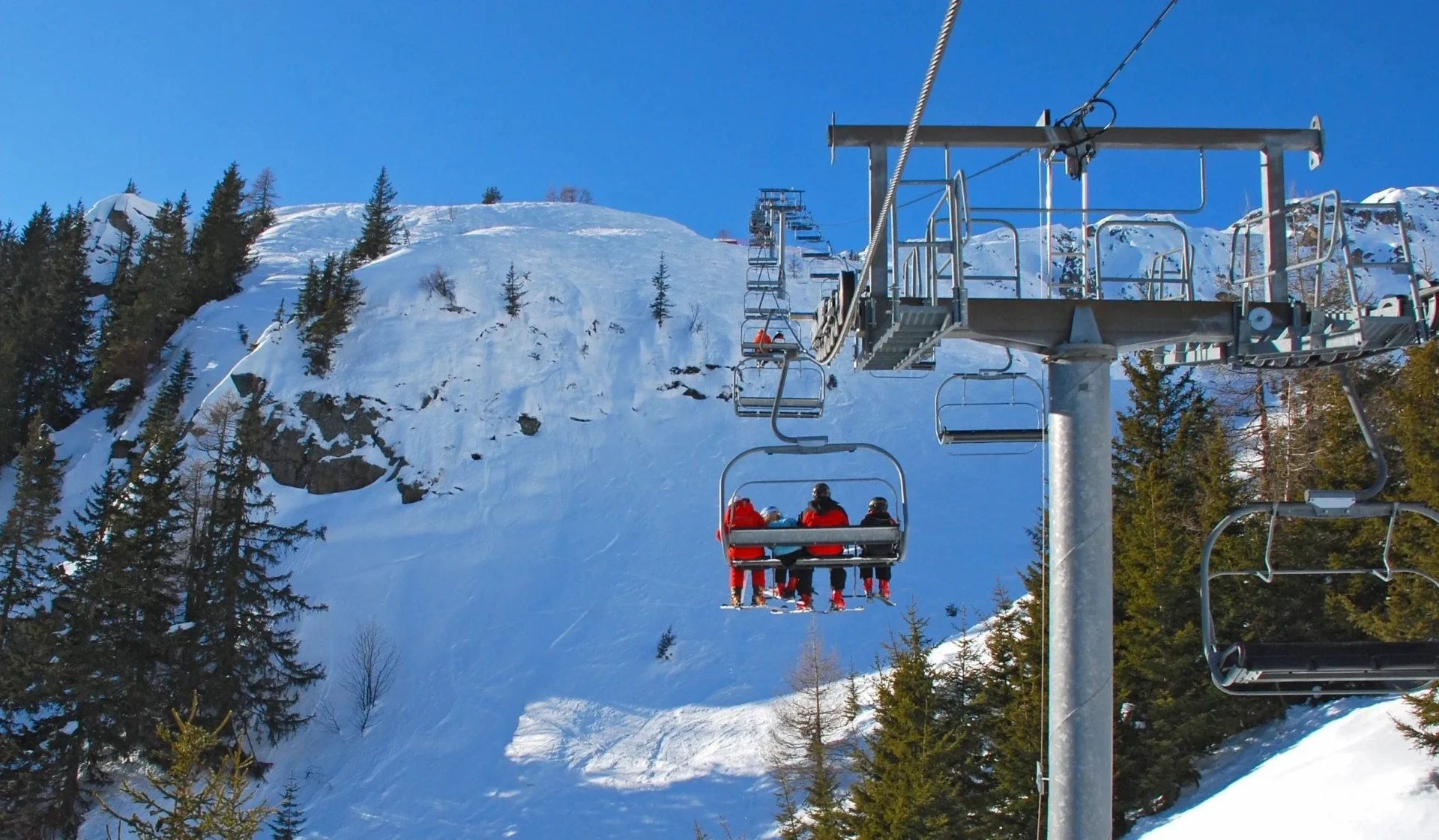 A ski lift with people riding on it