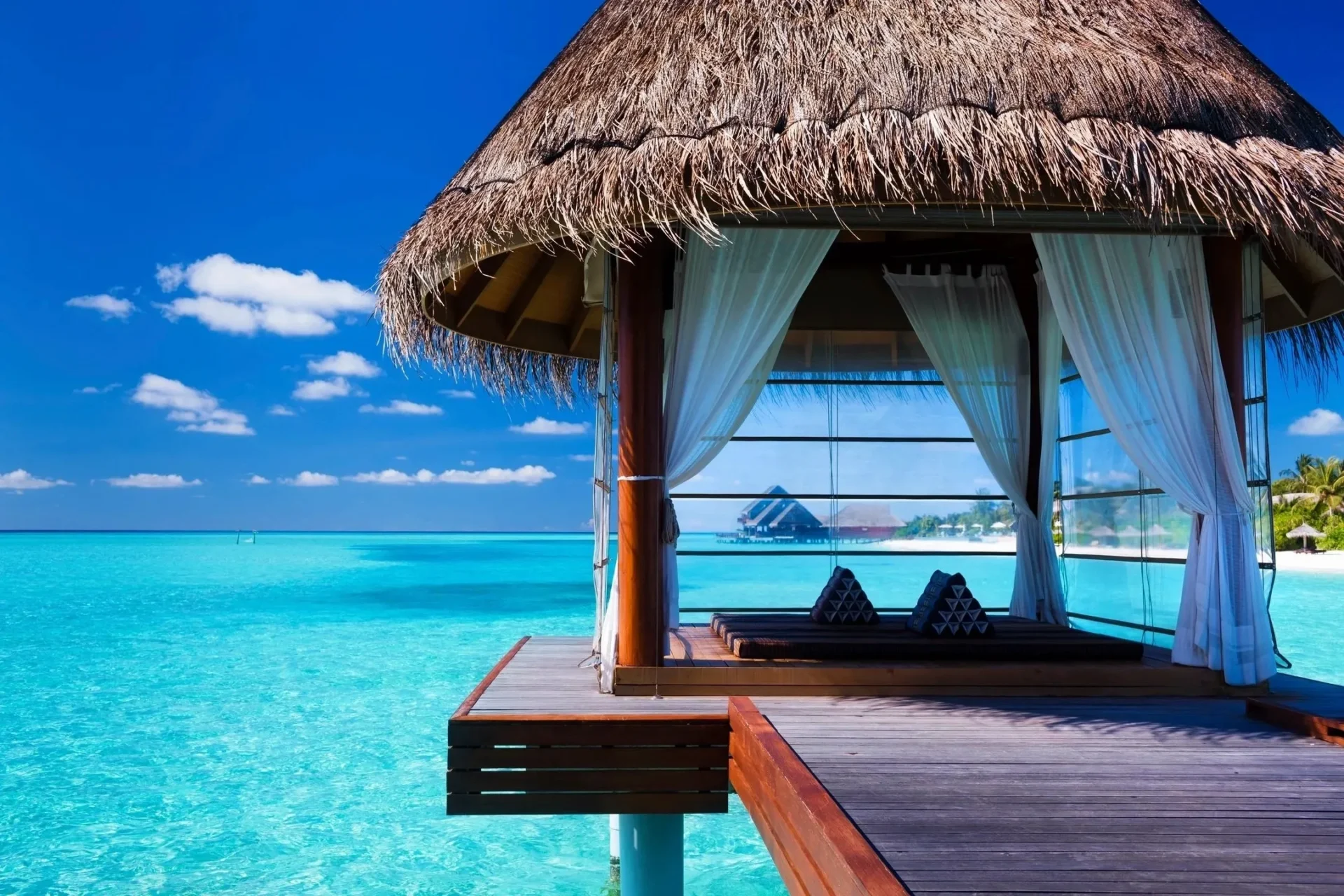 A hut with an umbrella on the beach